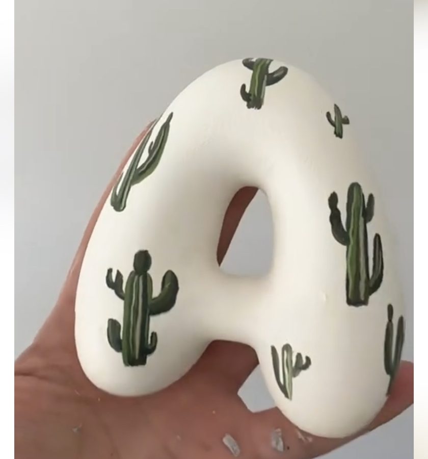 White letter with painted cacti