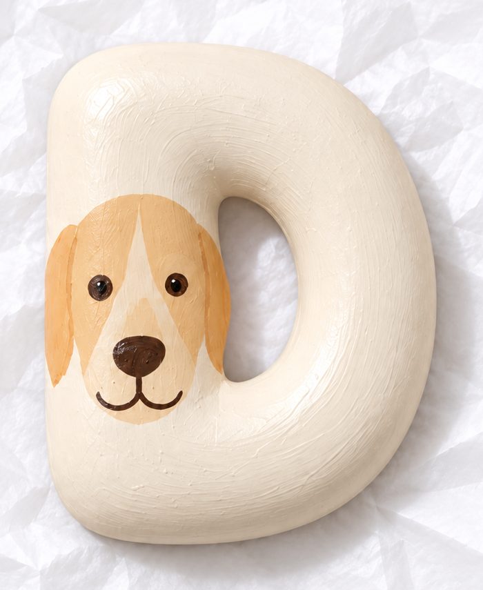Letter D with a painted dog face